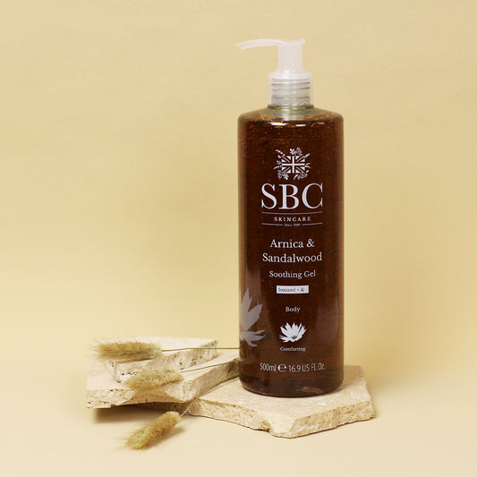 Arnica & Sandalwood Soothing Gel on a cream background with dried flowers
