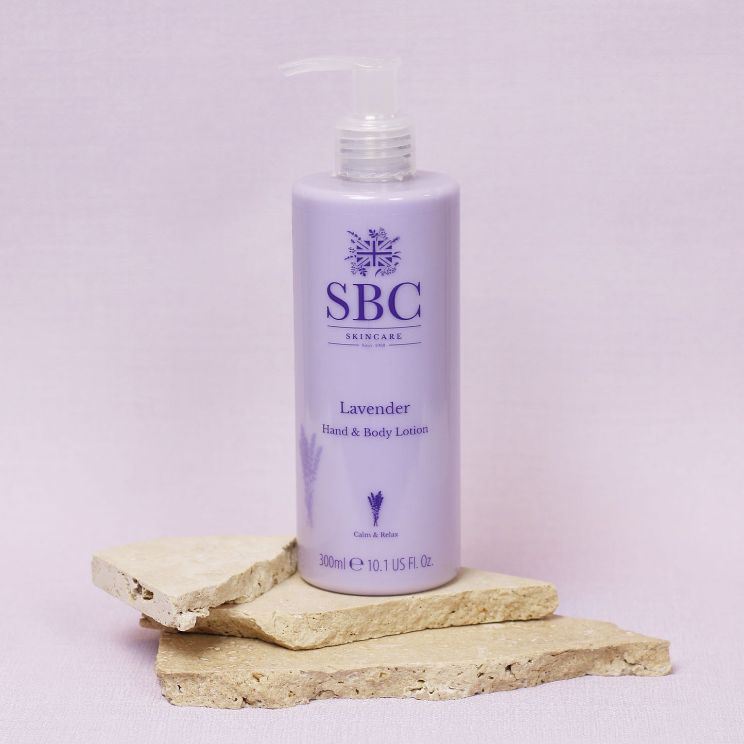 Lavender Hand & Body Lotion Sand Stone with a pale purple background 