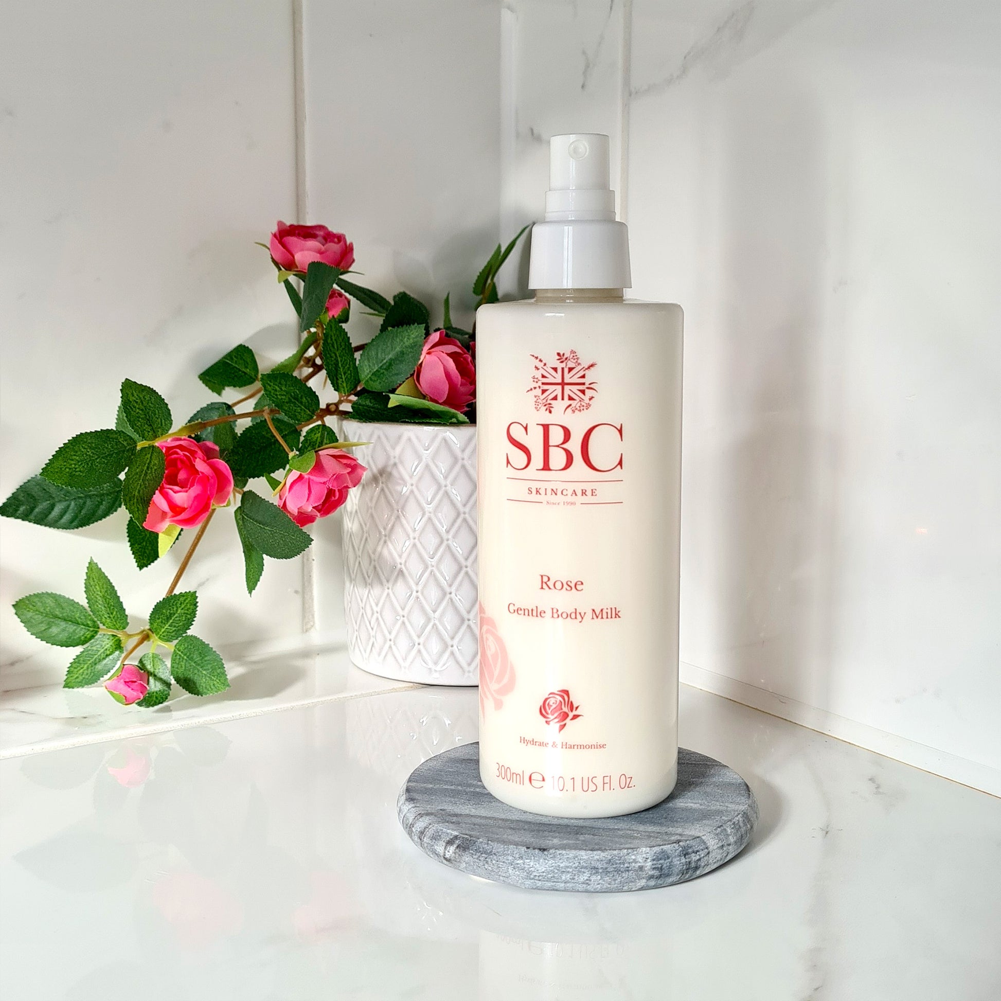 SBC Skincare's Rose Gentle Body Milk on a marble bathroom counter