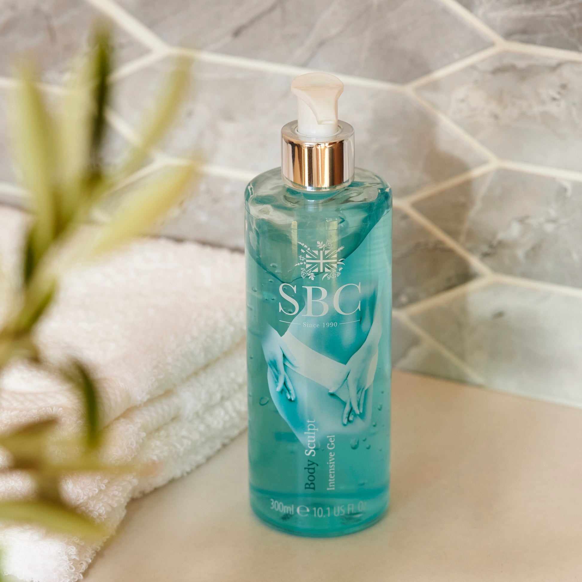 Body Sculpt Intensive Body Gel 300ml on on a stone bathroom counter with towels