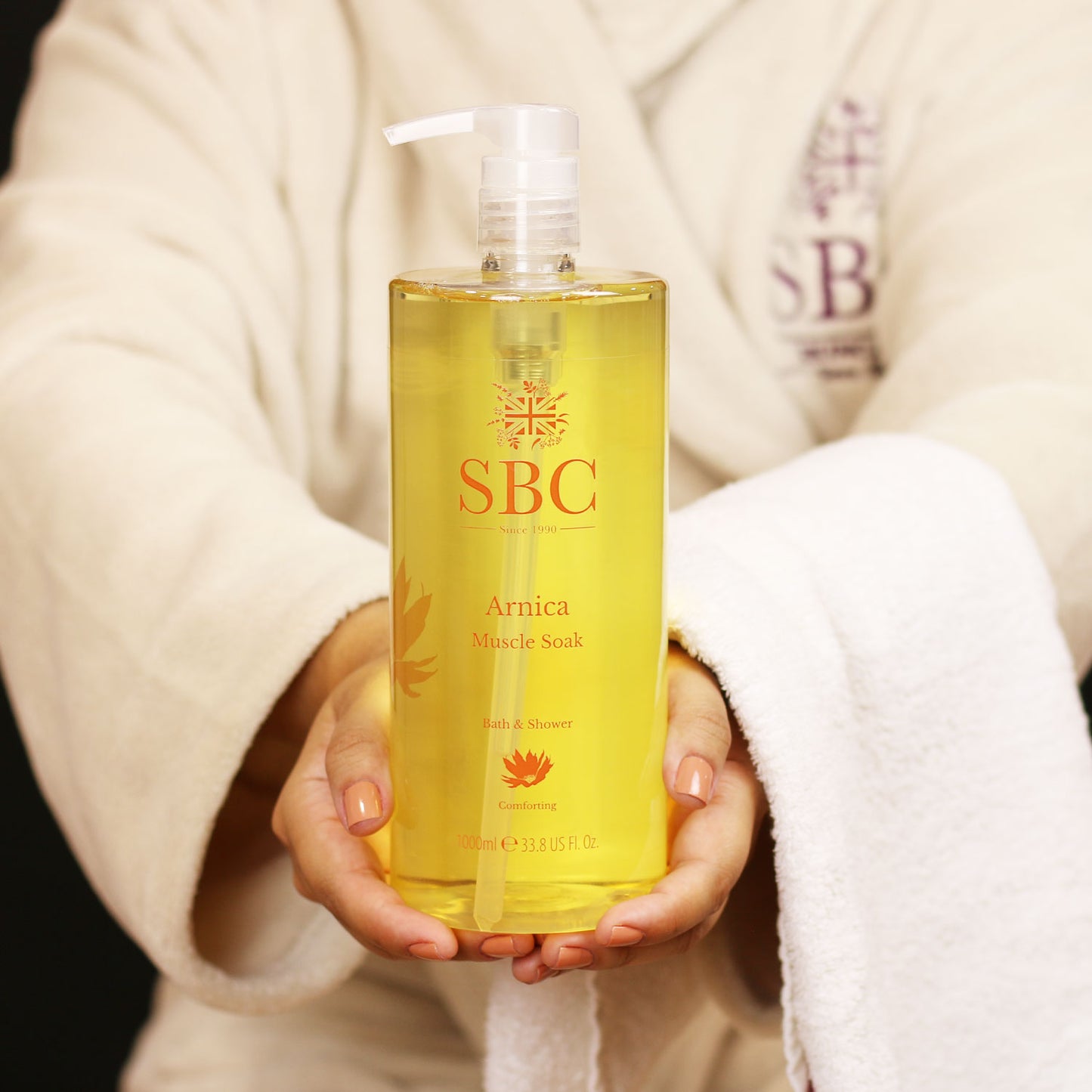 Woman holding SBC Skincare Arnica Muscle Soak