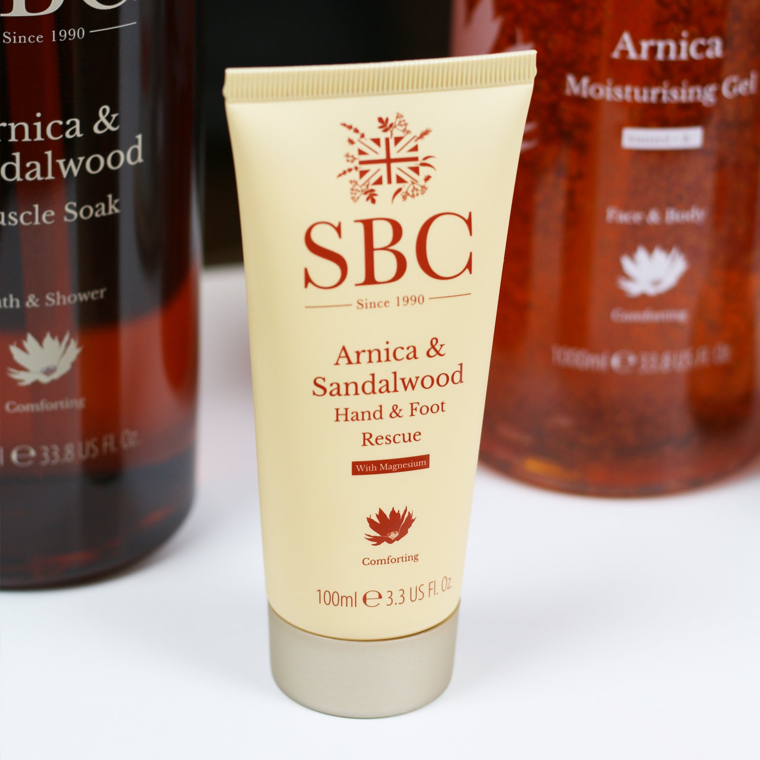 Arnica & Sandalwood Hand & Foot Rescue on a white counter 