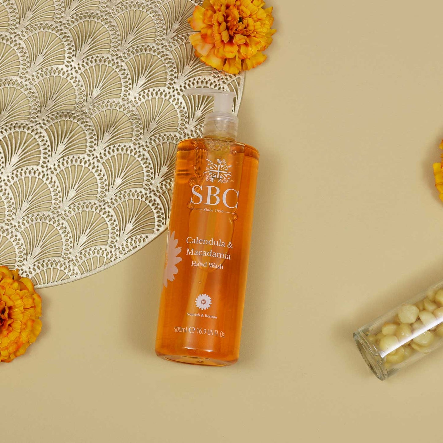 Calendula & Macadamia Hand Wash with Calendula Flowers and gold props 