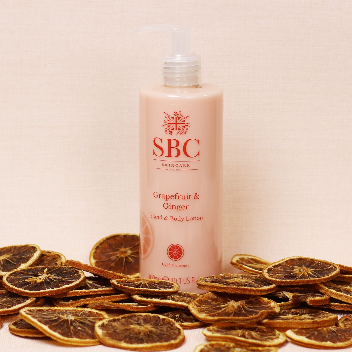 Grapefruit & Ginger Hand & Body Lotion with dried grapefruit slices 