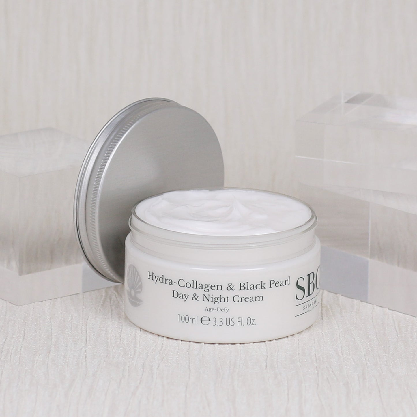 Hydra-Collagen & Black Pearl Day & Night Cream on a bright white background 