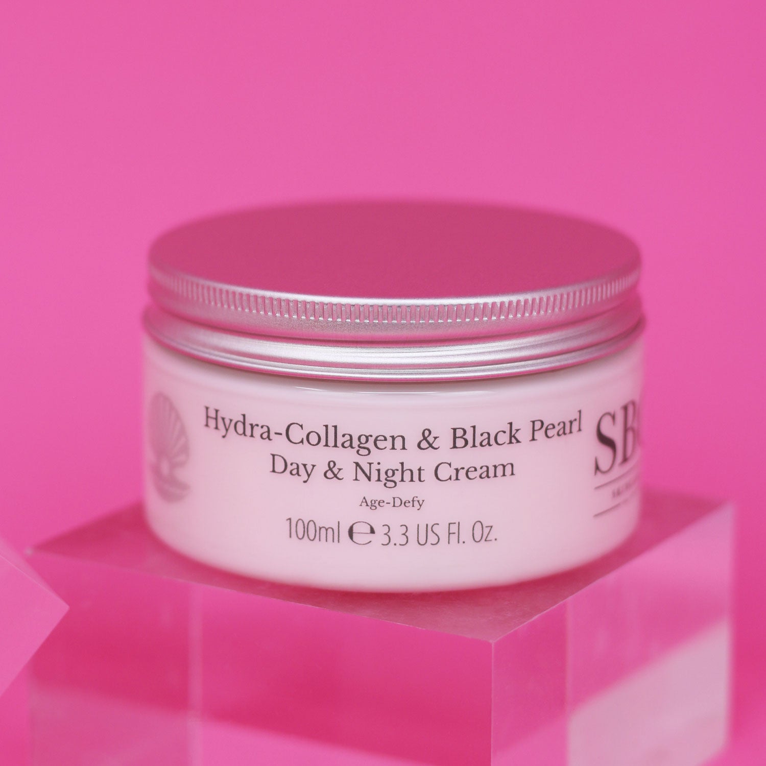 Hydra-Collagen & Black Pearl Day & Night Cream on a bright pink background 
