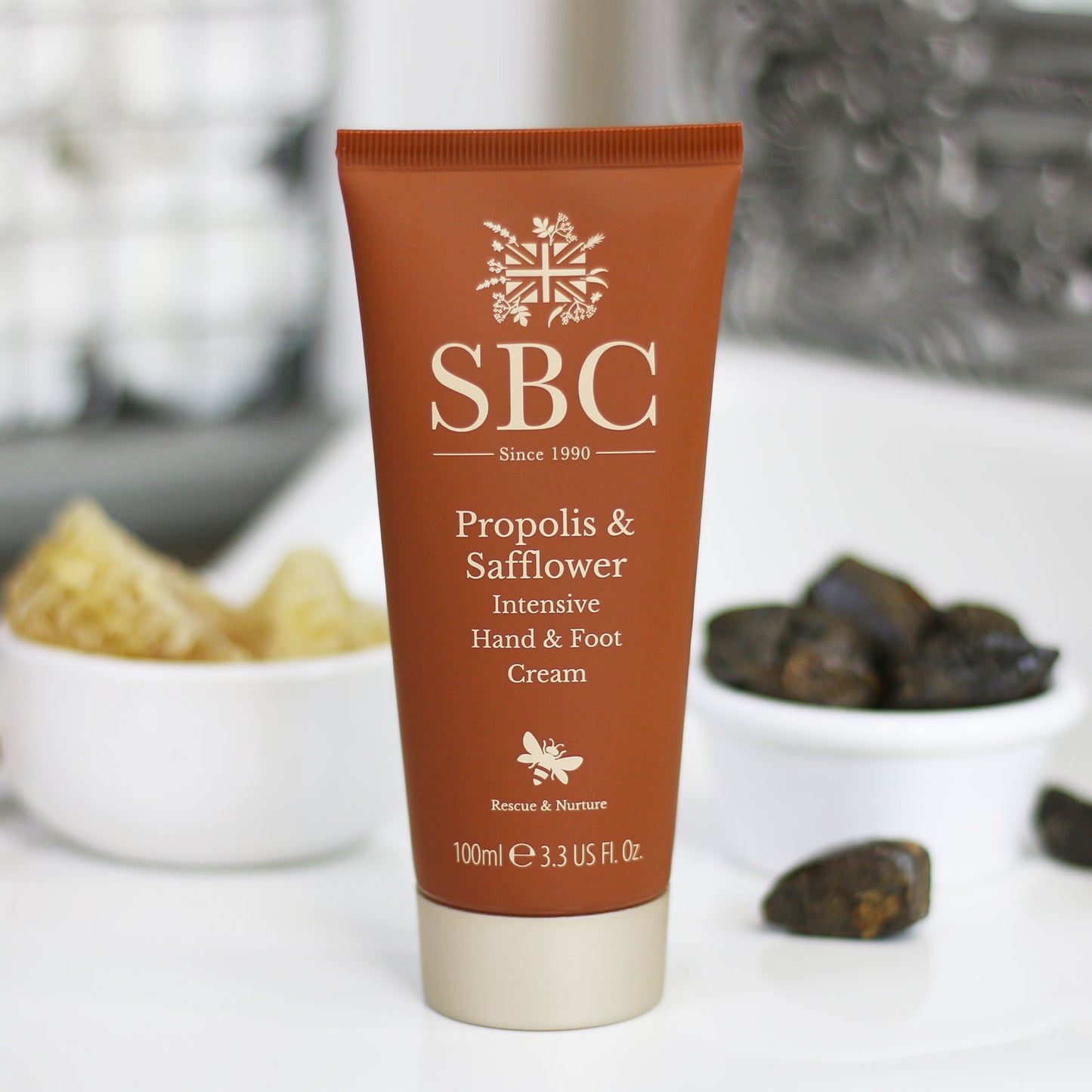 Propolis & Safflower Hand & Foot Cream on a bathroom sink 