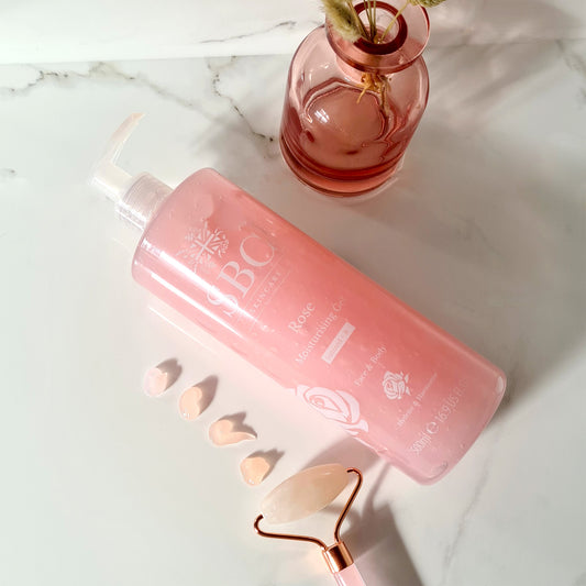 Rose Moisturising Gel on a marble counter with swatches and a pink vase